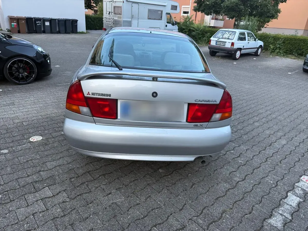 Gebraucht Mitsubishi Carisma 90 PS (66 kW) 1997 Grau Limousine