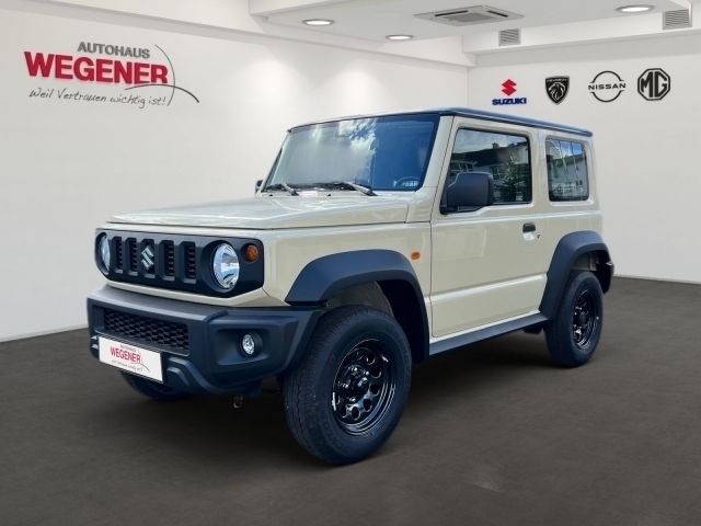 Chiffon/ bluish black pearl Gebraucht 2023 Suzuki Jimny Comfort SUV | 27.880 € (Guter Preis) - Bild 1/4