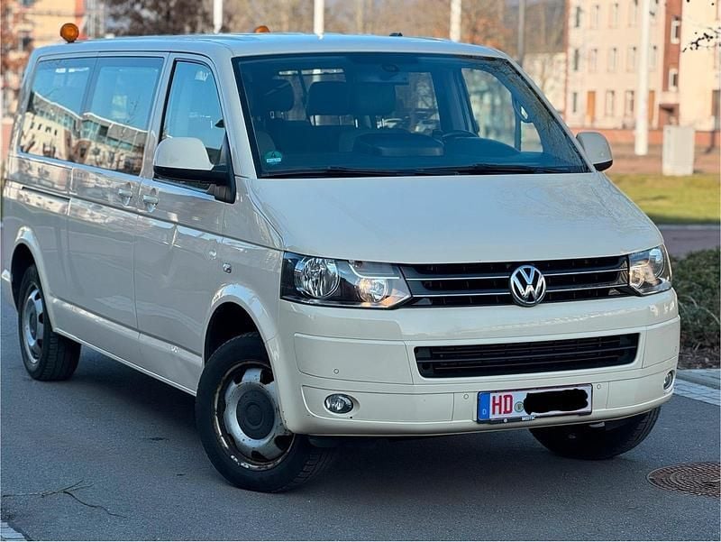 Gelb Gebraucht 2014 VW Caravelle Van / Kleinbus | 10.999 € (Superpreis) - Bild 1/4