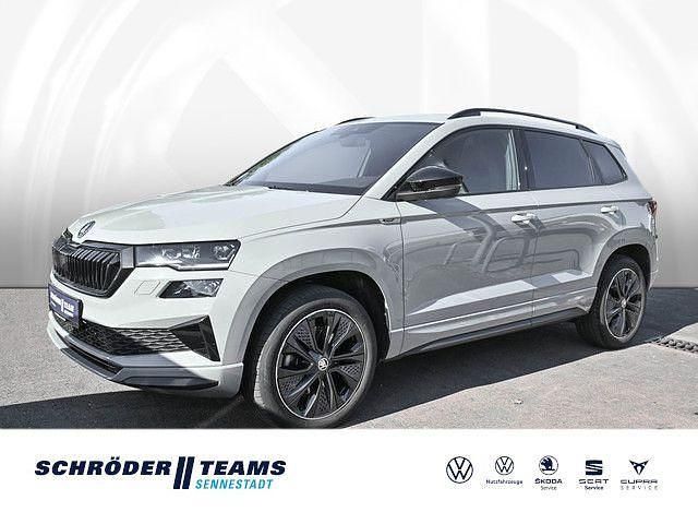 M steelgrau Gebraucht 2023 Skoda Karoq SUV | 32.890 € (Etwas zu teuer) - Bild 1/4