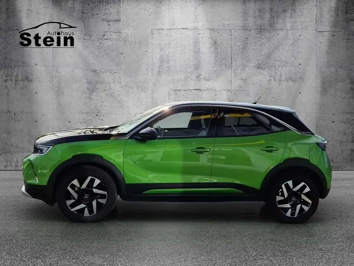 Gebraucht Opel Mokka-e Elegance 100 kW (136 PS) 2022 Matcha green/ikone gruen (metallic) SUV