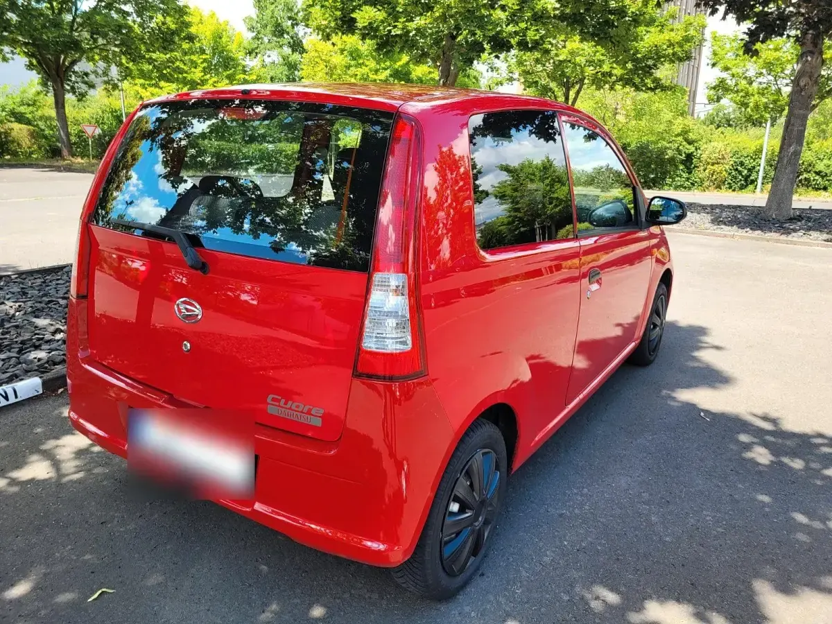 Gebraucht Daihatsu Cuore 58 PS (42 kW) 2006 Rot Kleinwagen