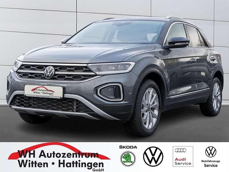 Indiumgrau metallic Gebraucht 2024 VW T-Roc Style SUV | 28.457 € (Guter Preis) - Bild 1/4