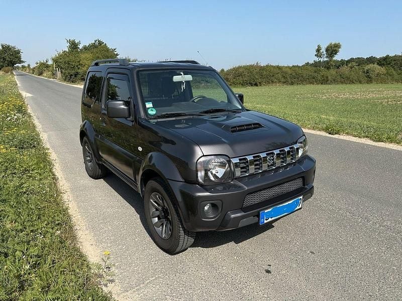 Grau Gebraucht 2018 Suzuki Jimny Comfort SUV | 19.200 € (Superpreis) - Bild 1/4
