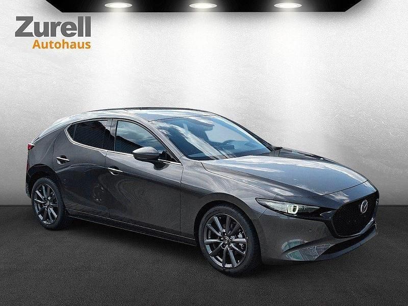 Machine gray Gebraucht 2024 Mazda 3 Exclusive-Line | 27.880 € (Fairer Preis) - Bild 1/4
