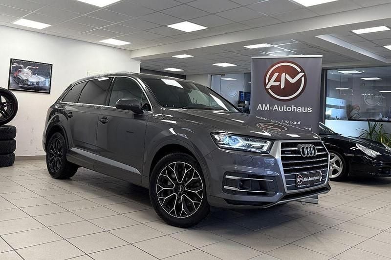 Samuraigrau metallic Gebraucht 2019 Audi Q7 Sport SUV | 29.999 € (Superpreis) - Bild 1/4
