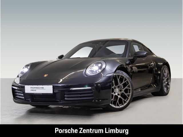 Tiefschwarzmetallic Gebraucht 2024 Porsche 911 Carrera Coupé | 124.790 € (Superpreis) - Bild 1/4