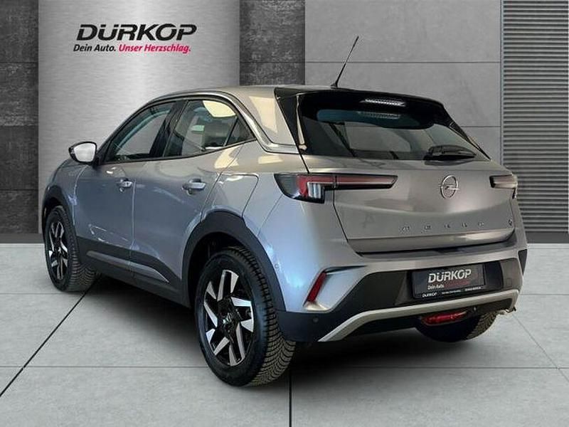 Gebraucht Opel Mokka-e Elegance 100 kW (136 PS) 2023 Kontrast grau/quarz silber SUV