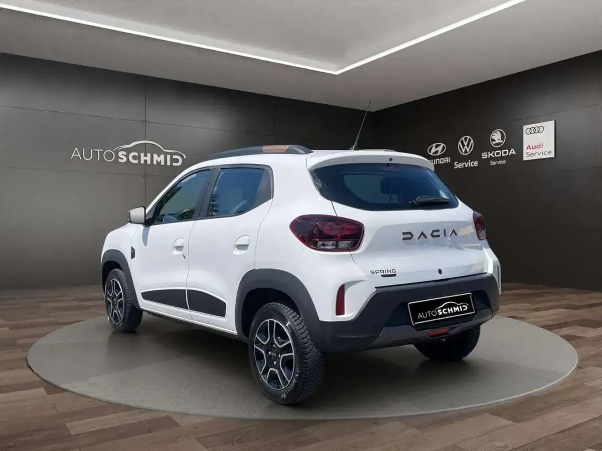 Gebraucht Dacia Spring Extreme 47 kW (65 PS) 2023 Polarweiss Kleinwagen