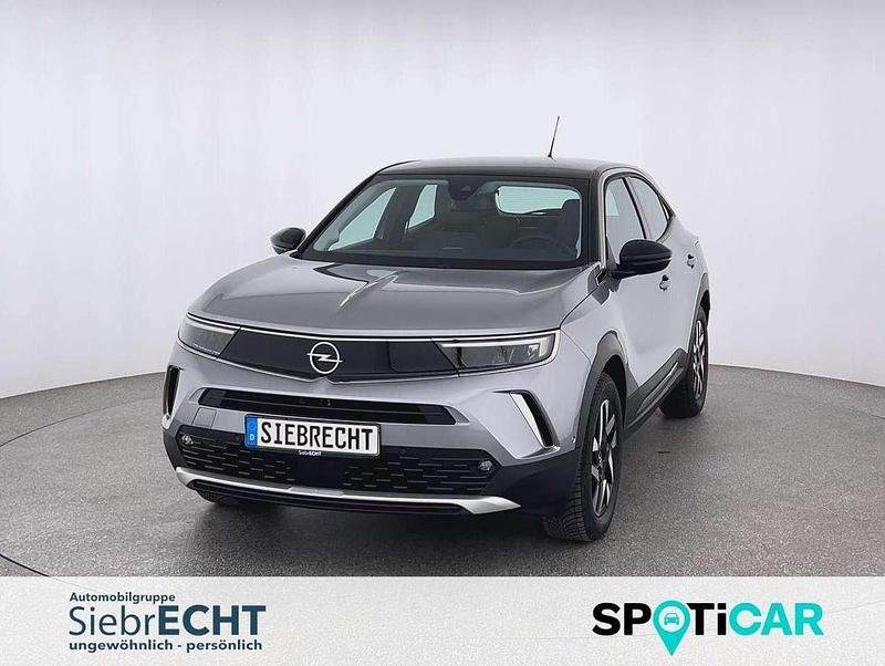 Grau Gebraucht 2023 Opel Mokka-e Elegance SUV | 20.970 € (Fairer Preis) - Bild 1/4