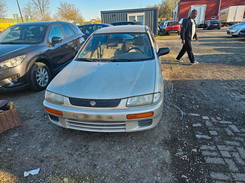 Second-hand Mazda 323 1996 Auriu Berlinǎ