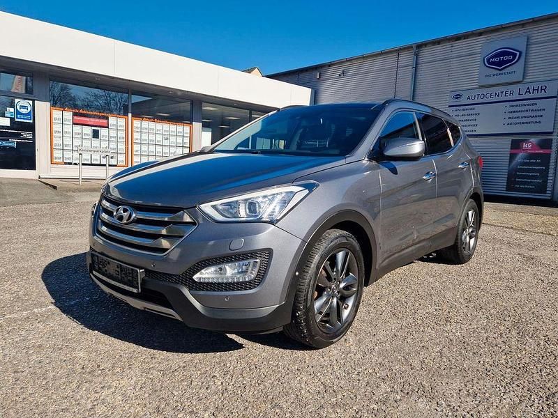 Titanum silver / met Gebraucht 2014 Hyundai Santa Fe Premium SUV | 12.350 € - Bild 1/4