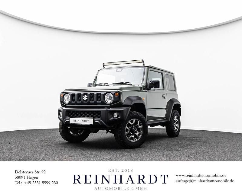 Grün Gebraucht 2019 Suzuki Jimny Comfort+ SUV | 25.930 € (Guter Preis) - Bild 1/4