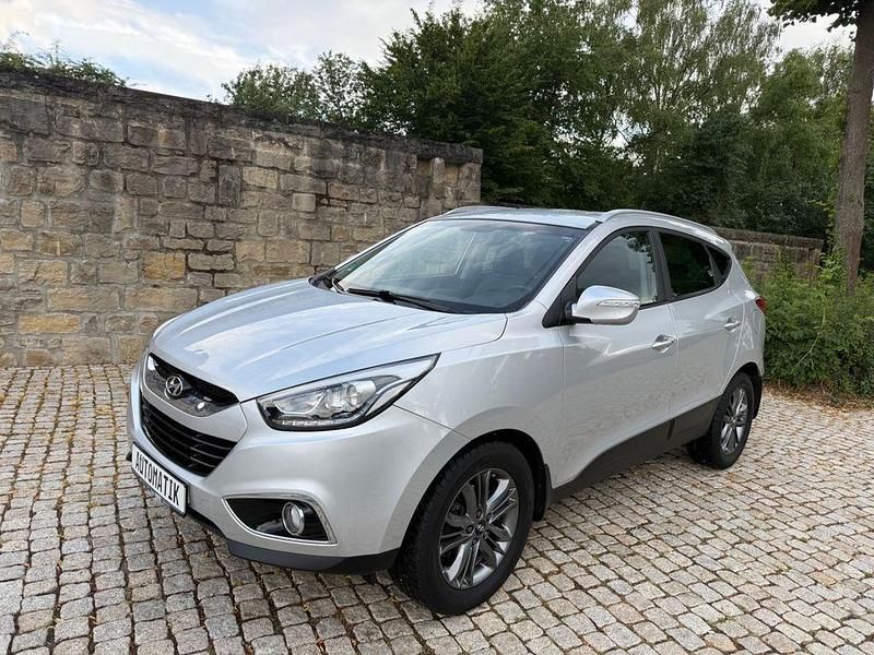 Silber Gebraucht 2015 Hyundai Tucson Premium SUV | 10.599 € (Superpreis) - Bild 1/4
