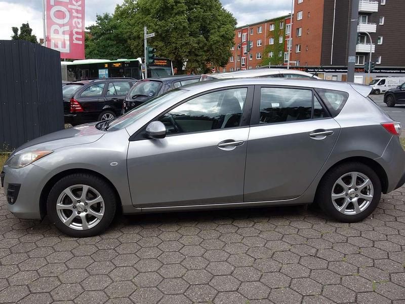 Grau Gebraucht 2009 Mazda 3 High Limousine | 5.999 € (Etwas zu teuer) - Bild 1/4