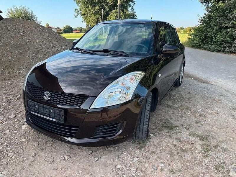 Braun Gebraucht 2013 Suzuki Swift Limousine | 4.700 € (Fairer Preis) - Bild 1/4