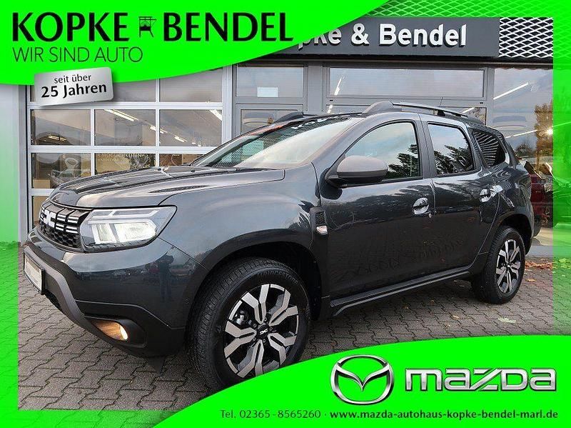 Kometengrau metallic Gebraucht 2024 Dacia Duster Journey SUV | 22.480 € (Guter Preis) - Bild 1/4