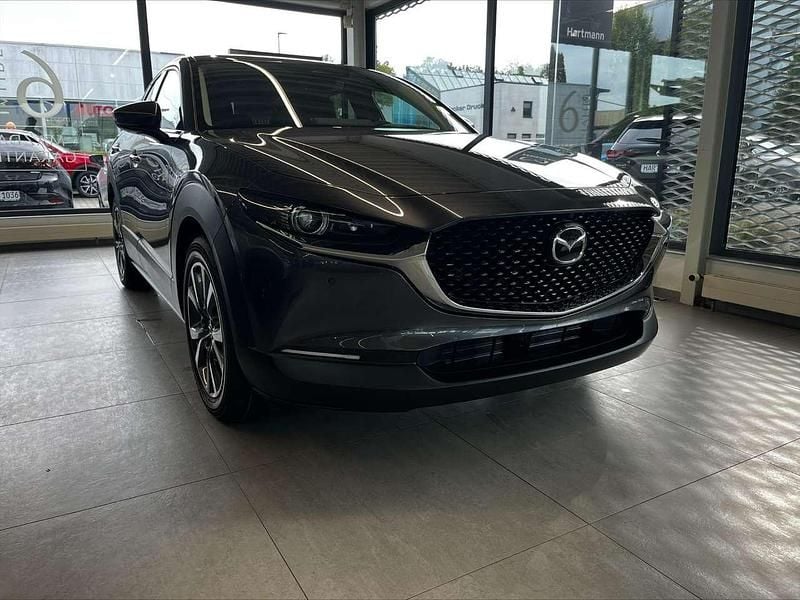 Machine grey Neu 2025 Mazda CX-30 Exclusive-Line SUV | 32.490 € - Bild 1/3