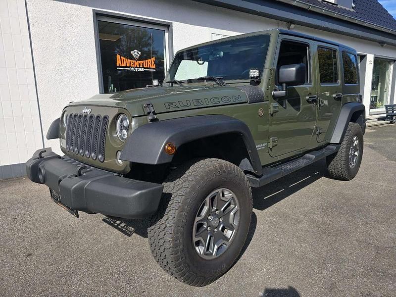 Grün Gebraucht 2015 Jeep Wrangler Unlimited Rubicon SUV | 38.900 € (Teuer) - Bild 1/4