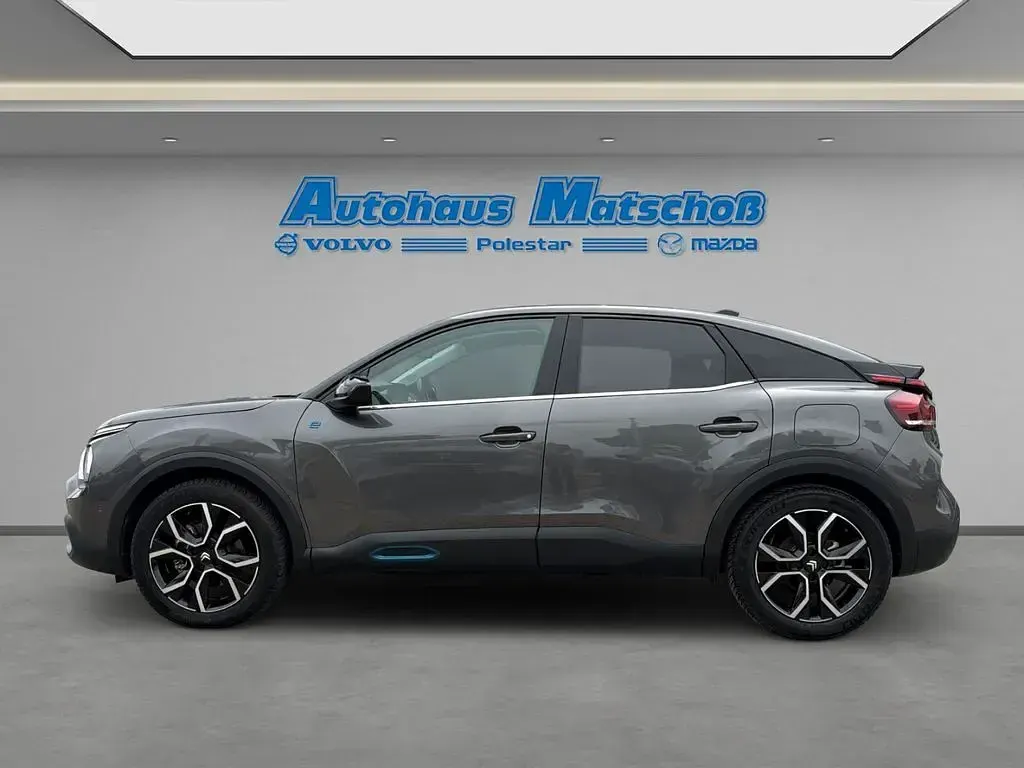 Gebraucht Citroën e-C4 Shine 100 kW (136 PS) 2023 Lackierung platiniumgrau/typ Limousine