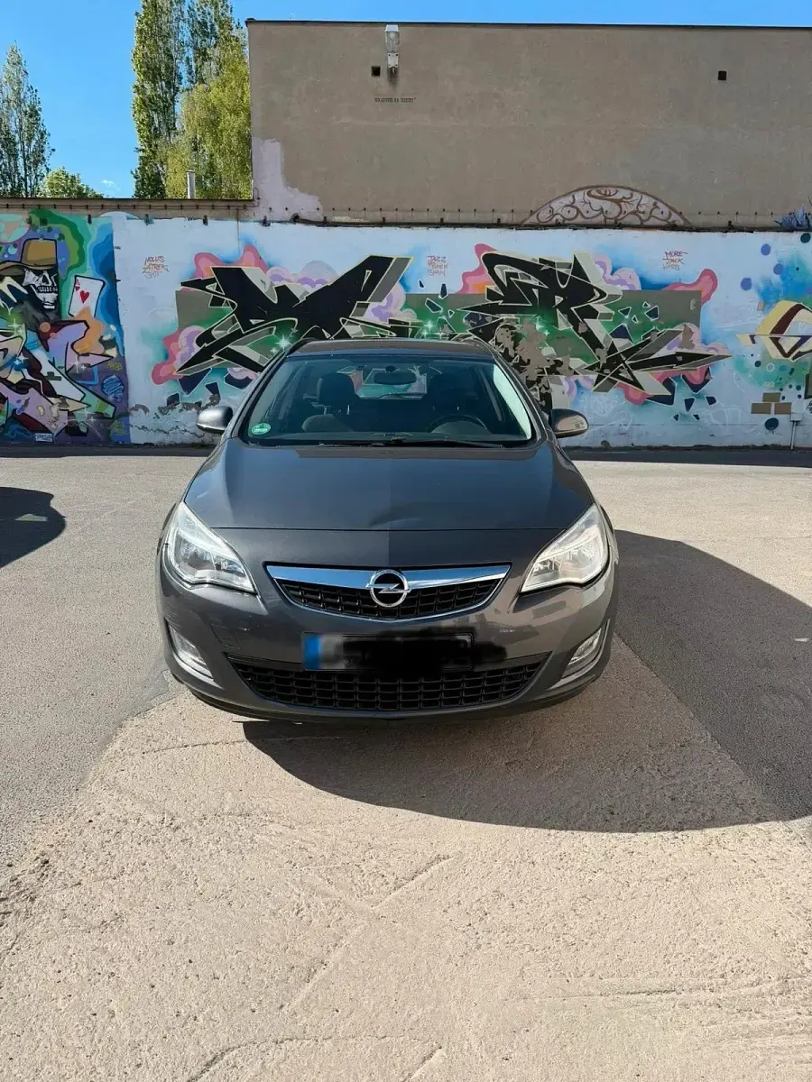 Usado Opel Astra 110 HP (80 kW) 2012 Cinzento Carrinha