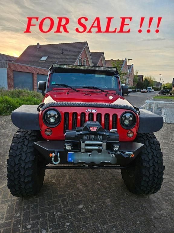Rot Gebraucht 2012 Jeep Wrangler Unlimited Sahara SUV | 36.500 € (Teuer) - Bild 1/4