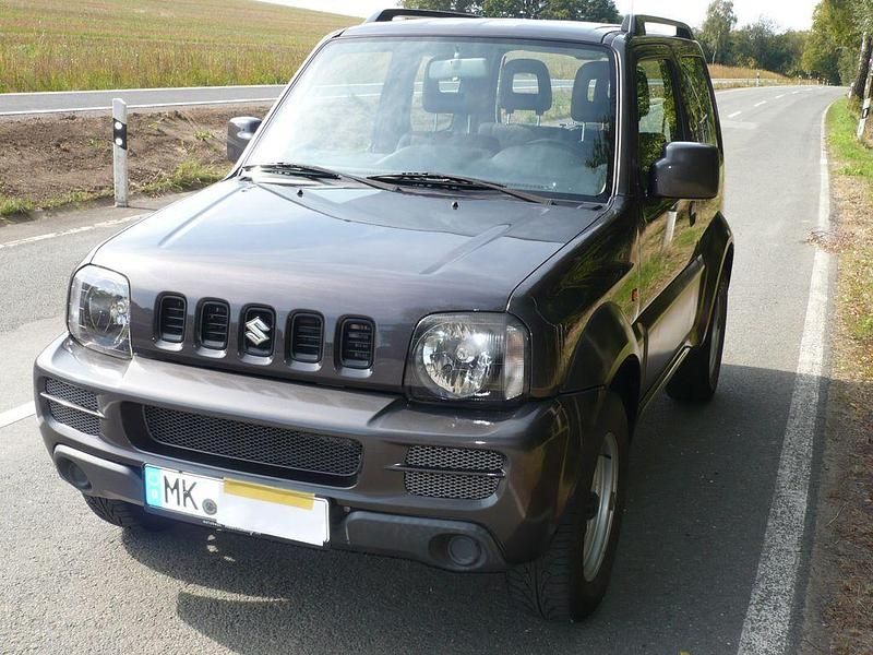 Grau Gebraucht 2011 Suzuki Jimny SUV | 10.400 € (Fairer Preis) - Bild 1/4