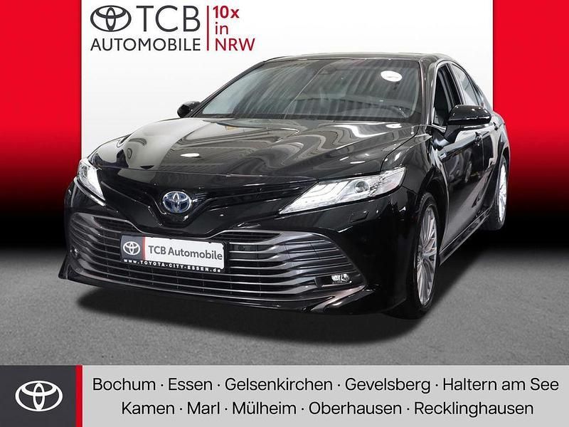 Schwarz Gebraucht 2021 Toyota Camry Hybrid Executive Limousine | 33.989 € - Bild 1/4