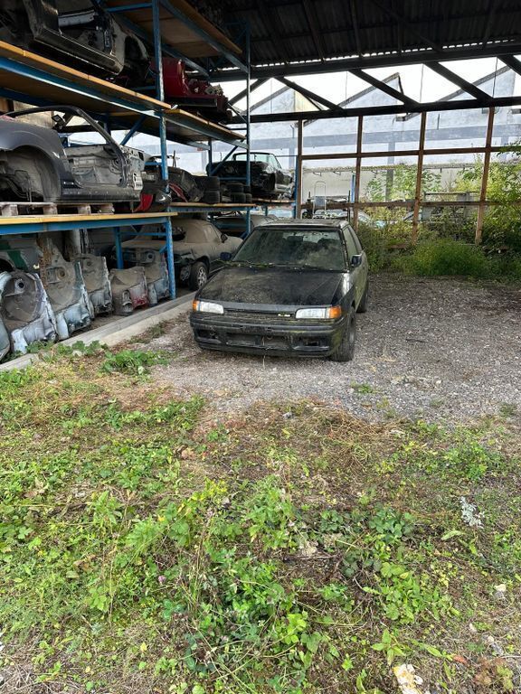 Schwarz Gebraucht 1991 Mazda 323 | 6.699 € - Bild 1/4