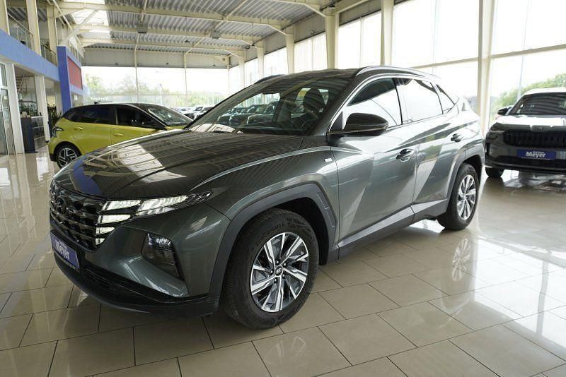 Amazon grey (metallic) Gebraucht 2023 Hyundai Tucson SUV | 25.710 € (Superpreis) - Bild 1/4