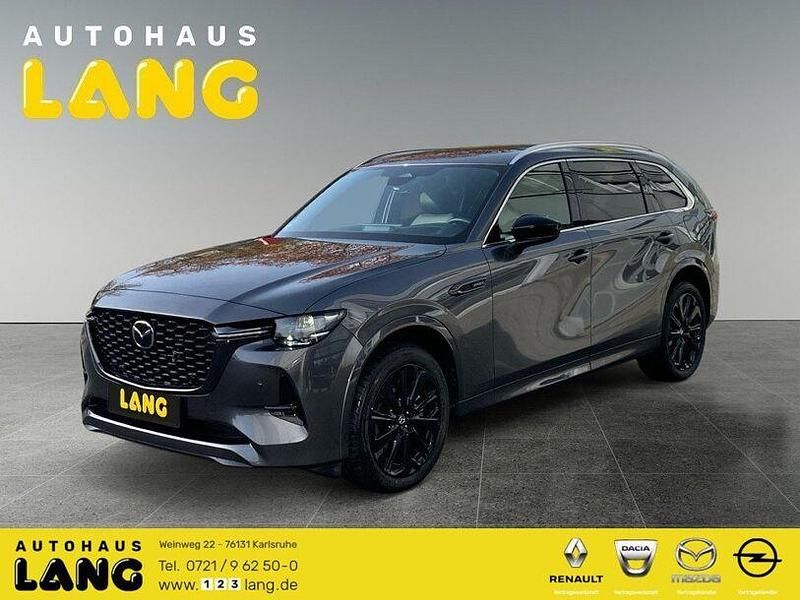 Machine gray (metallic) Gebraucht 2024 Mazda CX-80 Homura-Line SUV | 51.990 € (Fairer Preis) - Bild 1/4