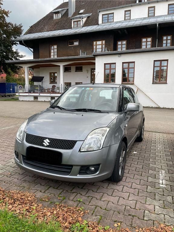 Grau Gebraucht 2007 Suzuki Swift Comfort Limousine | 1.300 € (Superpreis) - Bild 1/4