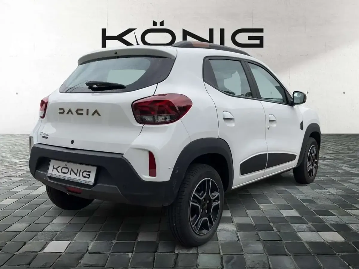 Gebraucht Dacia Spring Extreme 47 kW (65 PS) 2023 Kaolinweiß Kleinwagen