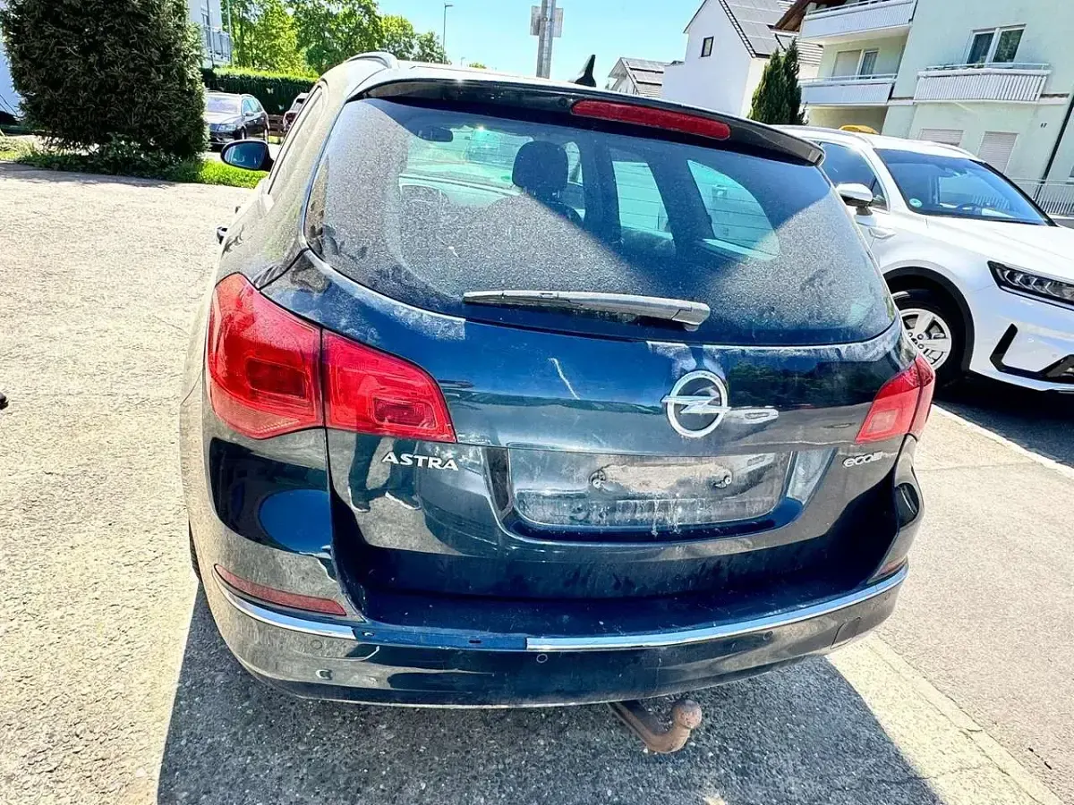 Gebraucht Opel Astra Style 110 PS (80 kW) 2016 Smaragd gruen (mi) Kombi
