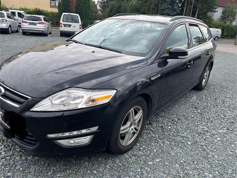 Pantherschwarz metallic Gebraucht 2014 Ford Mondeo Ambiente Kombi | 3.999 € - Bild 1/4