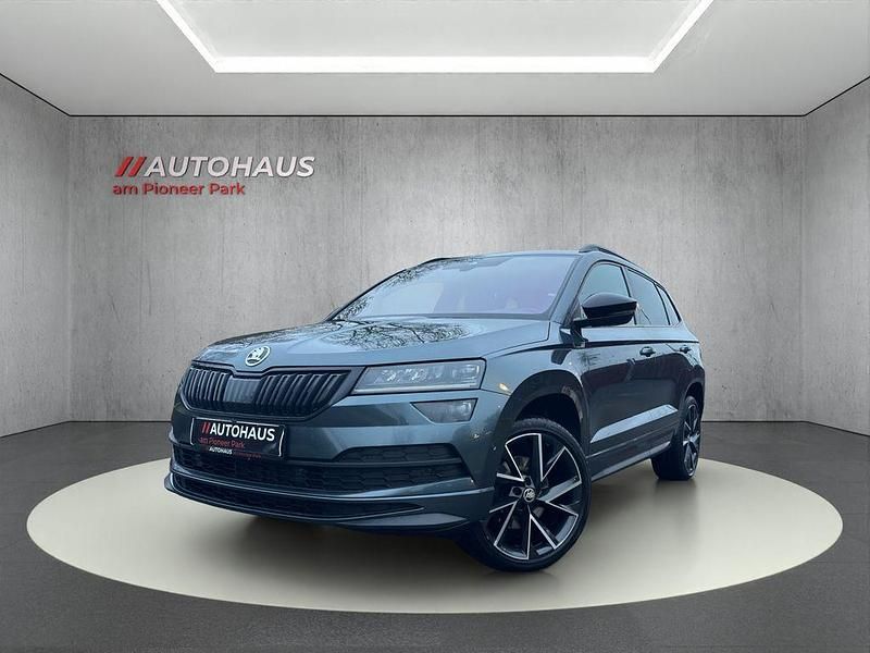 Grau Gebraucht 2021 Skoda Karoq SportLine SUV | 22.490 € (Fairer Preis) - Bild 1/4