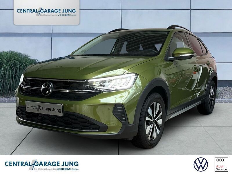 Visual green (metallic) Gebraucht 2024 VW Taigo Move SUV | 22.480 € (Fairer Preis) - Bild 1/4
