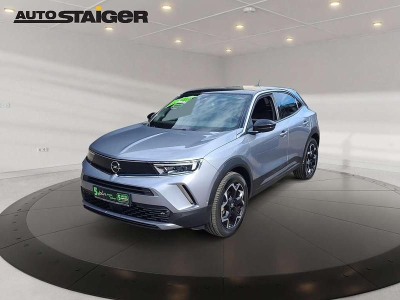 Gebraucht Opel Mokka Ultimate 131 PS (96 kW) 2023 Kontrast grau/quarz silber SUV