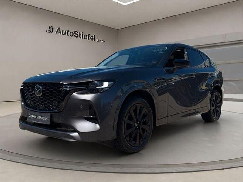 Machine grey (metallic) Gebraucht 2023 Mazda CX-60 Homura-Line SUV | 40.590 € (Etwas zu teuer) - Bild 1/4