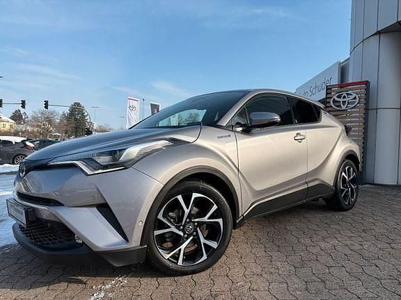 Metalstreamgrau metallic Gebraucht 2018 Toyota C-HR+ Plus SUV | 18.990 € (Fairer Preis) - Bild 1/4