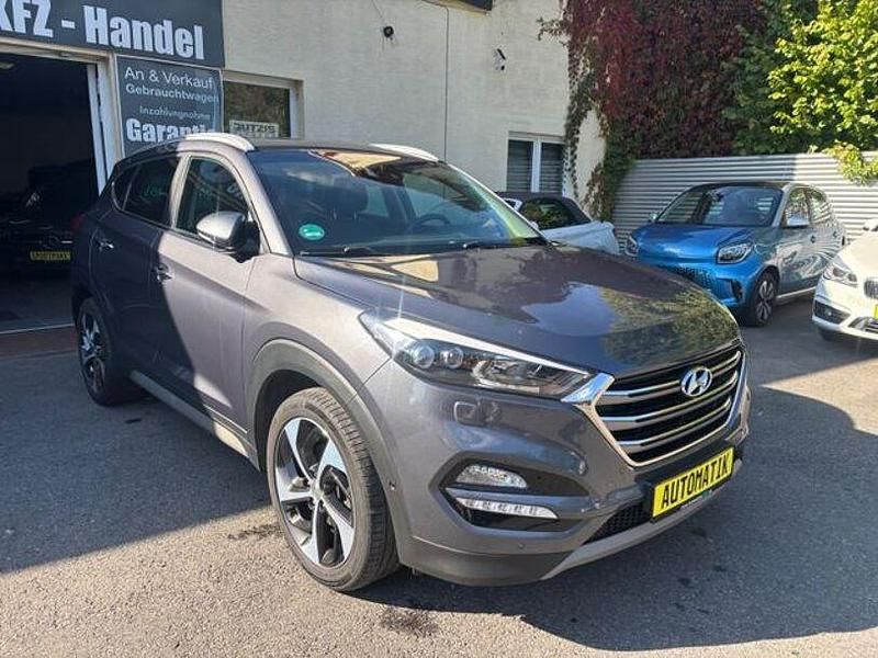Grau Gebraucht 2017 Hyundai Tucson Premium SUV | 16.961 € (Fairer Preis) - Bild 1/4