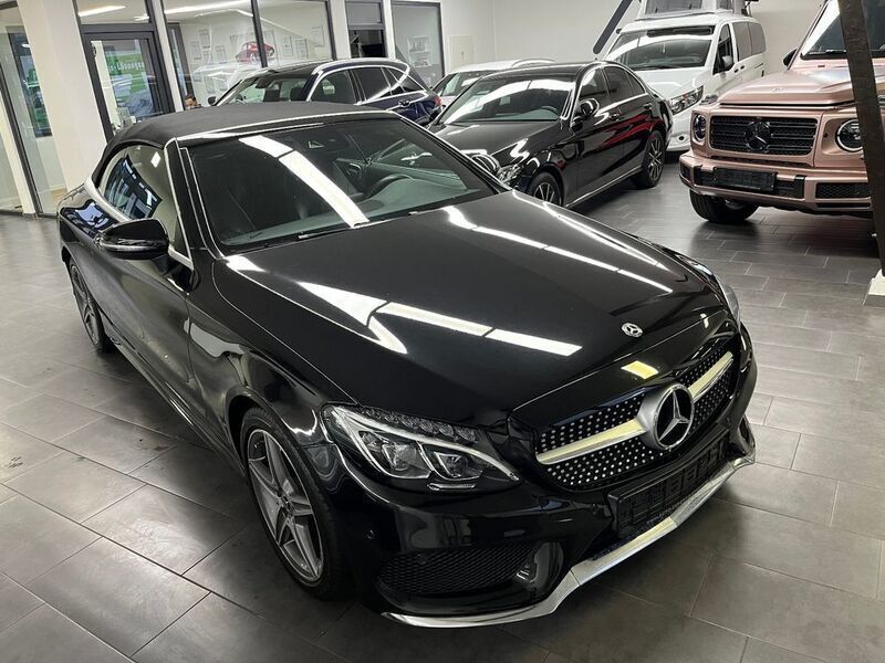 Obsidianschwarz metalliclack Gebraucht 2018 Mercedes C180 AMG Cabrio | 25.999 € (Guter Preis) - Bild 1/4