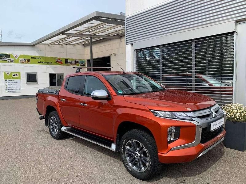 Zirkonorange Gebraucht 2021 Mitsubishi L200 Select Abholung | 37.490 € (Etwas zu teuer) - Bild 1/4