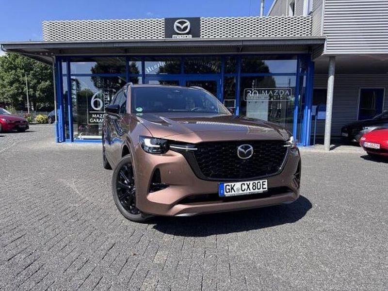 Gold Gebraucht 2024 Mazda CX-80 Homura-Line SUV | 53.900 € (Fairer Preis) - Bild 1/4