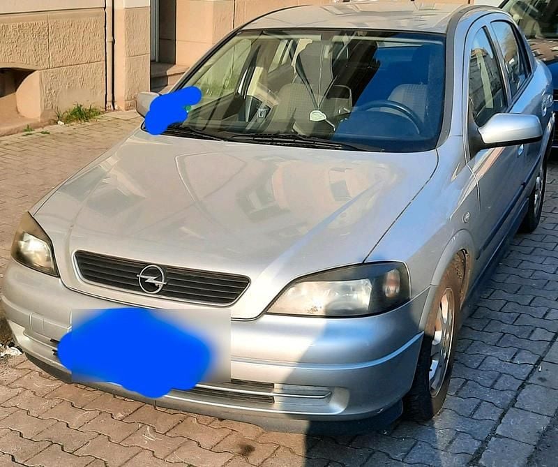 Second-hand Opel Astra 84 CP (61 kW) 2009 Argintiu Coupe