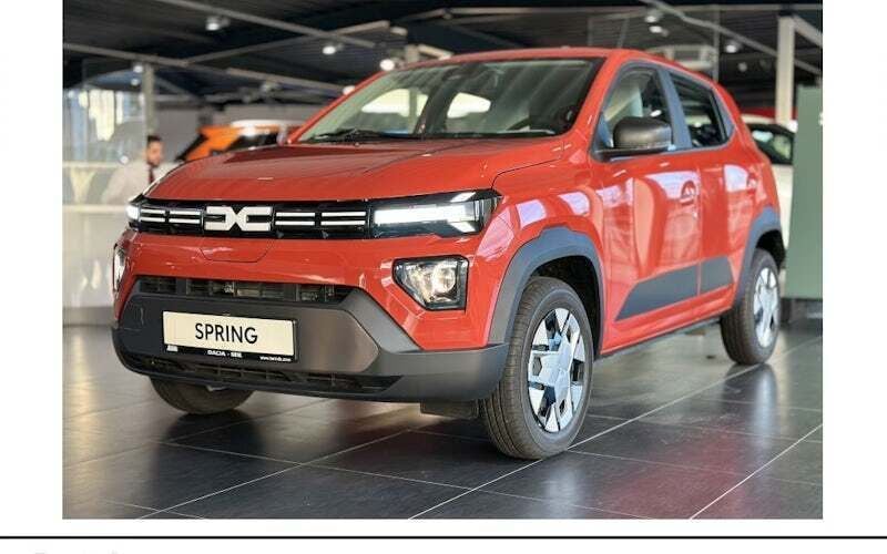 Brick red Neu 2024 Dacia Spring Expression Kleinwagen | 15.498 € (Fairer Preis) - Bild 1/4