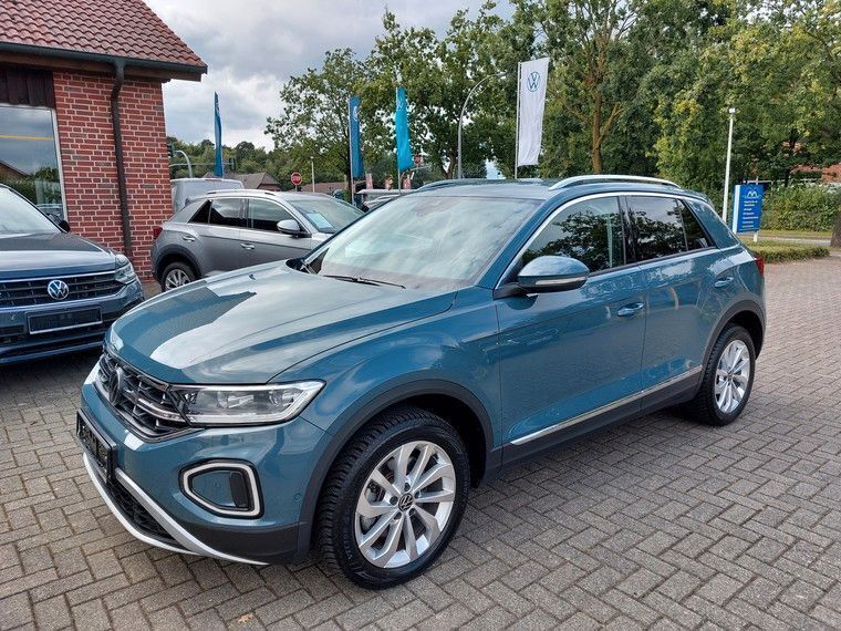 Petroleum blue metallic Gebraucht 2023 VW T-Roc Style SUV | 28.490 € (Fairer Preis) - Bild 1/4