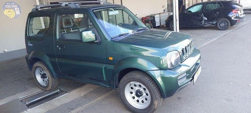 Grün Gebraucht 2012 Suzuki Jimny Club SUV | 12.550 € (Fairer Preis) - Bild 1/4