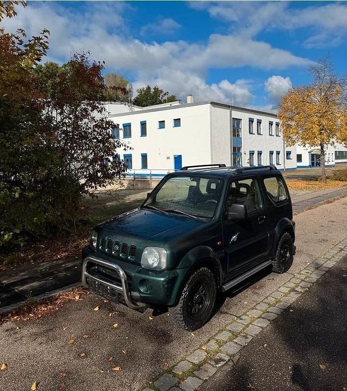 Grün Gebraucht 2003 Suzuki Jimny SUV | 5.799 € (Fairer Preis) - Bild 1/4