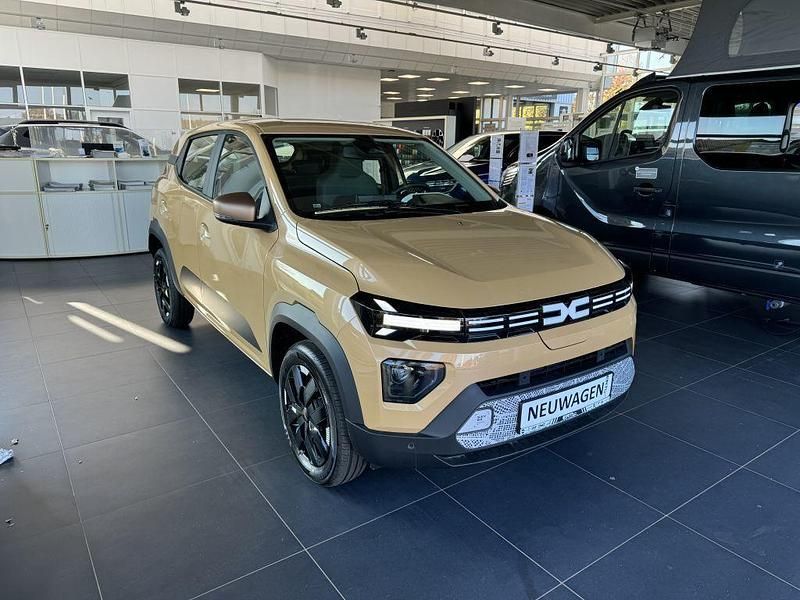 Gebraucht Dacia Spring Extreme 47 kW (65 PS) 2023 Safaribeige Kleinwagen